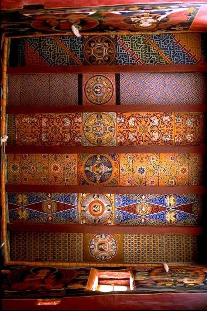 Tibet Guge 06 Tsaparang White Temple 10 12 Jowo Khang Ceiling The roof of the temple may also be considered as the richest and most finely worked out in the whole of Western Tibet. … It is made of large wooden planks, brought with great labour from the Himalayan valleys towards India, well smoothed and then painted. Their decoration consists in a series of mandalas, all on the same axis, and of stylized floral and geometric motifs, never repeating themselves. - Giuseppe Tucci: The Temples of Western Tibet and their Artistic Symbolism (1935). Photo – <a class=
